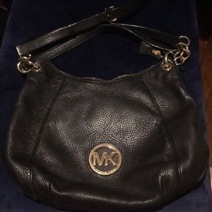 Black leather Michael Kors medium sized bag